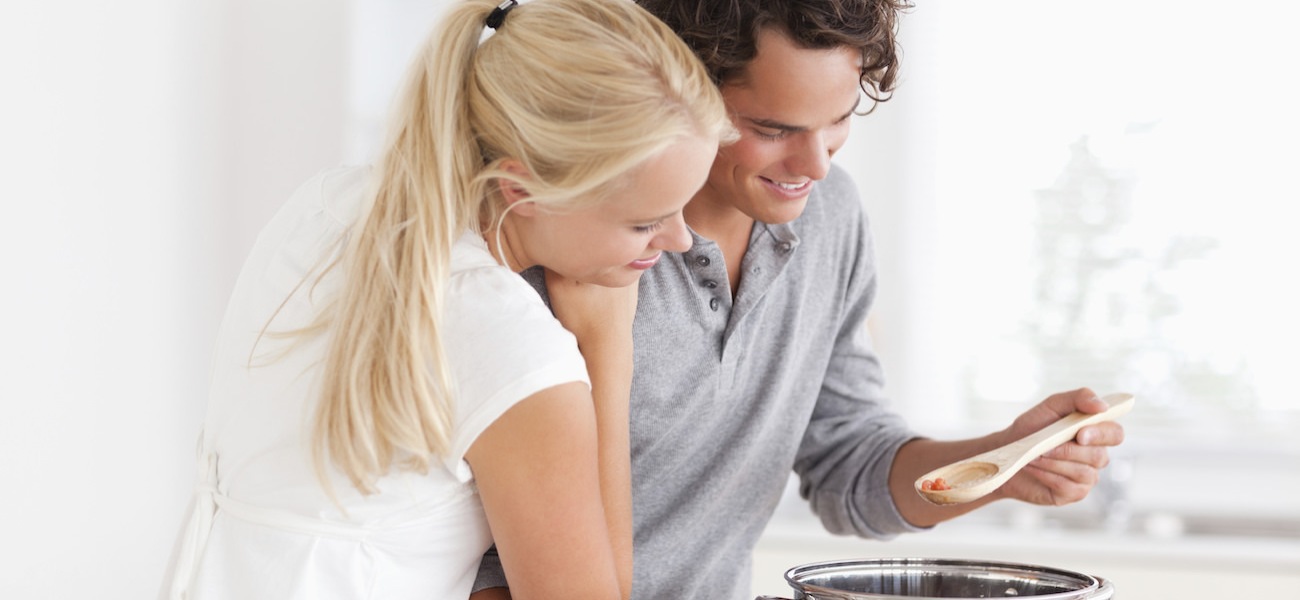 Homepage rotator with couple cooking together in very bright kitchen